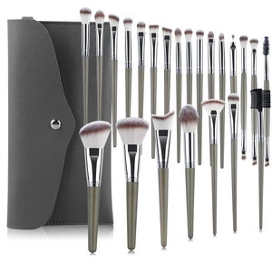 24-piece professional makeup brush set with green handles and gray storage bag