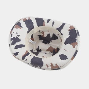 Classic white cowboy hat with ethnic cow print pattern and interior sweatband detail