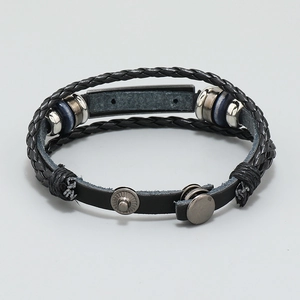 Detailed view of multi-strand braided black leather bracelet with sleek metal clasp