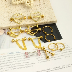 Golden stainless steel nipple rings set with crystal hearts and chain pendants