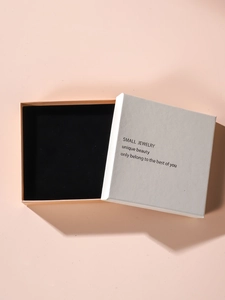 Minimalist pink and off-white jewelry gift box with velvet insert and English text