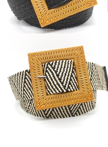 Detail of wide bohemian woven belts with large square wooden-style buckles in black and white