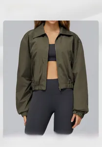 Close-up of olive green windproof sports jacket with zipper closure and classic collar