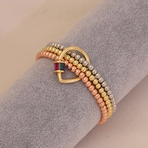 Three-tone beaded bracelet set featuring a gold heart padlock with colorful crystals