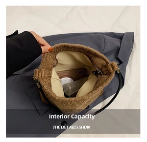 Internal capacity of brown teddy wool bucket bag showing space for phone and makeup