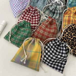 Various patterns of drawstring fabric storage pouches for jewelry and small items