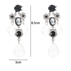 Detailed view of vintage cameo drop earrings with black roses and 8.5cm length dimensions
