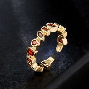 Irregular geometric open ring in 18K gold plated copper with orange-red zircon stones