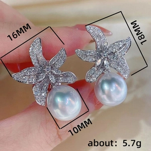 Exquisite pearl drop earrings featuring crystal-encrusted flower petals with 10mm round pearls