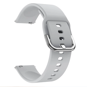 Detail of light grey silicone watch strap with silver metal buckle on white background
