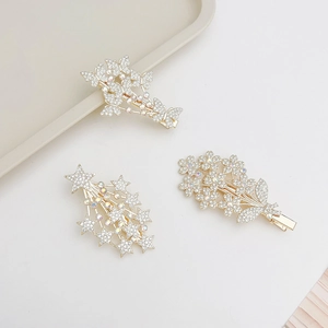 Elegant gold metal hair clips set with rhinestone butterfly, star and flower designs