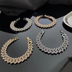 Detail of four-color iced out Cuban link bracelets with sparkling crystals in a row