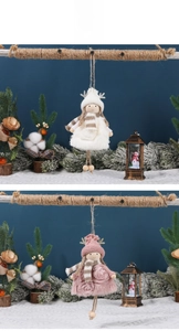 Detail of Christmas angel doll ornaments with lace skirts, knit caps, and antlers