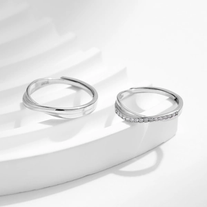 Elegant S925 sterling silver Mobius couple rings set with minimalist cubic zirconia stone