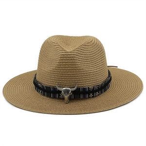 Brown woven straw cowboy hat with wide brim and silver steer skull metal decoration