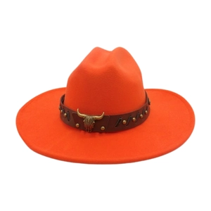 Close-up of orange western cowboy hat with bull head ornament and metal rivets on band