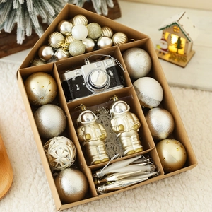 Detailed set of festive gold and silver Christmas ornaments in creative gift packaging