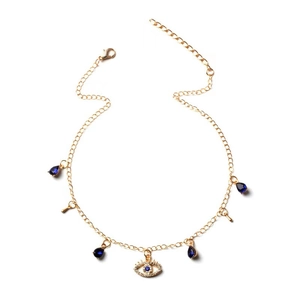Collana dorata con pietra blu a goccia e ciondolo occhio del diavolo con cristalli