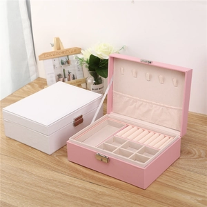 Dual-layer leather jewelry box featuring ring slots, necklace hooks and metal lock