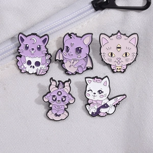 Five-piece creepy cute purple cat and skull enamel pins set on canvas background