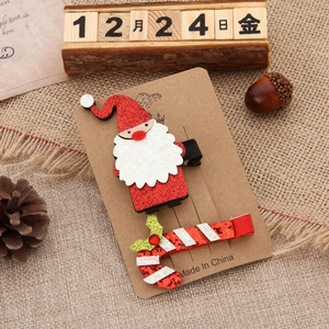 Set di fermagli per capelli natalizi con Babbo Natale e bastoncino di zucchero