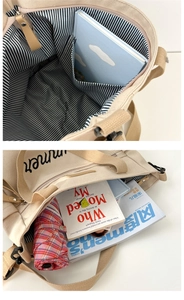 Detail of beige canvas tote bag showing striped lining and spacious interior storage
