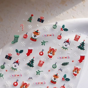 Christmas cartoon nail stickers featuring festive dogs and trees on light marble background