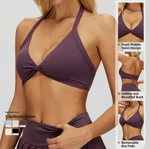 Halter neck sports bra in deep purple featuring twist front and hollow out back design
