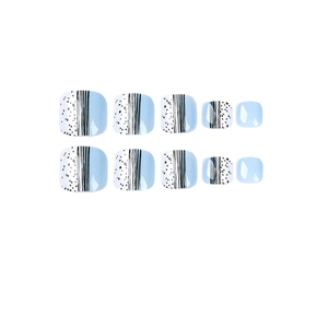 Sky blue and white geometric toe press-on nails with black stripes and dot patterns