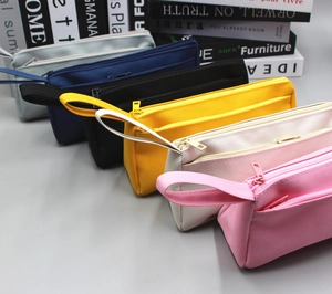 Row of large capacity canvas pencil cases in six colors with zippers and side handles