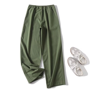 Detail view of military green cotton linen wide-leg pants with high-quality fabric texture