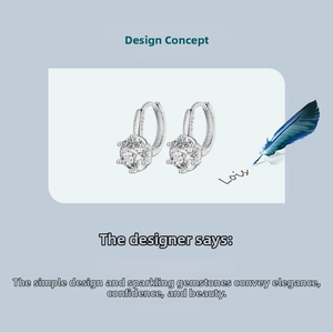 Close-up of sparkling round zircon earrings with 6-prong setting in s925 silver finish