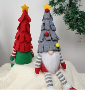 Close-up of festive Christmas gnomes with tree-shaped pointed hats and star toppers