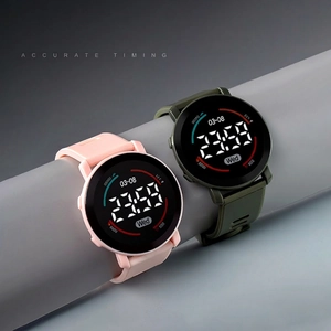 Minimalist digital sports watch with round LED dial and silicone strap in pink and green