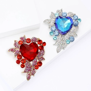 Exquisite alloy heart brooch with red and blue rhinestones on white background