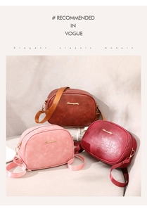 Detailed view of vintage oil wax leather cross-body bags in brown, pink and burgundy