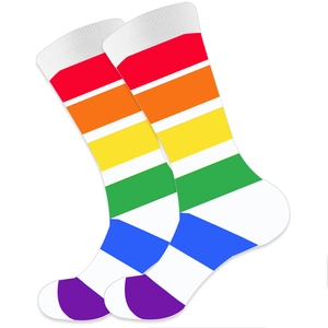 Classic crew socks with vibrant rainbow stripes on soft white cotton knit fabric