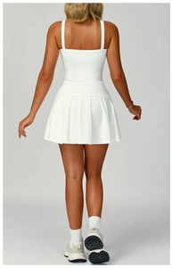 Rear view of white tennis outfit showing racerback top and pleated skirt details
