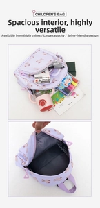 Detail view of large capacity kids backpack interior showing spacious compartments for school supplies