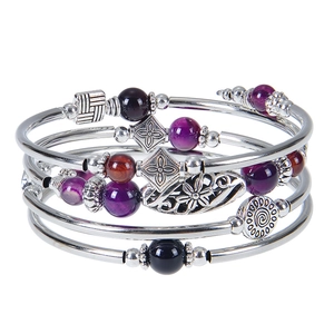 Detail of bohemian multilayer wrap bracelet with imperial stone and metal beads