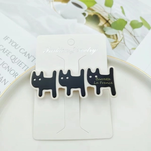 Cute black and white acetate cat hair clip on professional fashion jewelry card display