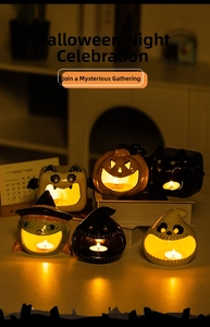 Macro view of six diverse ceramic Halloween tealight holders with spooky hollow cutouts