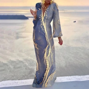 Women's V-neck long sleeve bohemian maxi dress with blue and gold marble print on beach