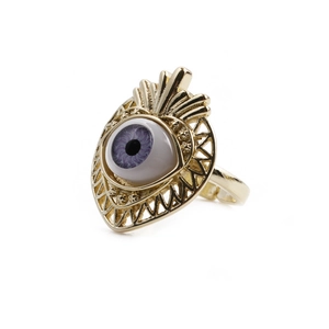 Gold-plated ring featuring an eye design with a purple iris and zircon setting