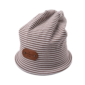 Striped knit beanie hat in brown and white with leather patch and metal rivets