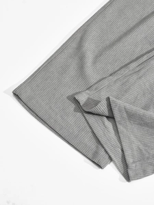 Close-up detail showing the ribbed texture of the gray casual sportswear fabric