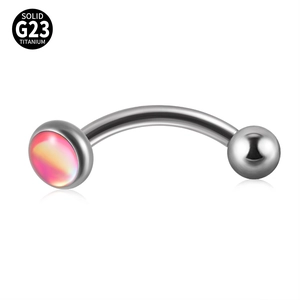 Detailed macro view of G23 titanium curved barbell with pink gradient gem inlay