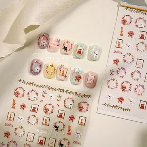 Detail of floral animal nail stickers with poodles and bunnies in soft pastel colors