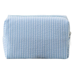 Blue striped seersucker makeup bag with a rectangular shape and top zipper closure