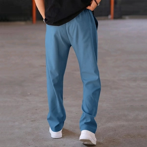 Rear view of loose-fit blue men's straight trousers with comfortable athletic cut